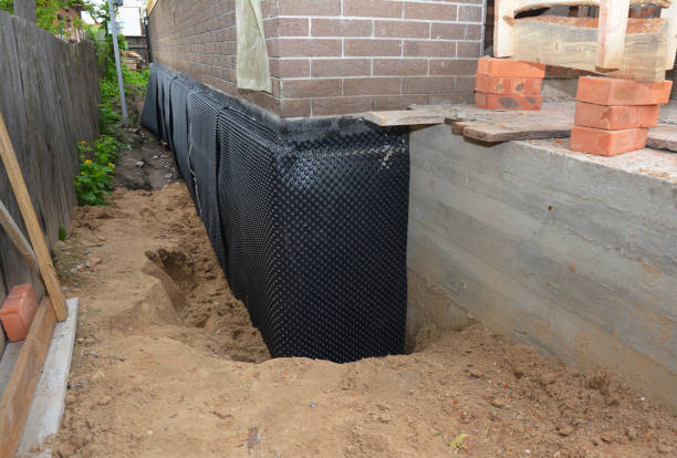 SJ Waterproofing Pros technician performing targeted Sump Pump Installation assessment in Austin, IN